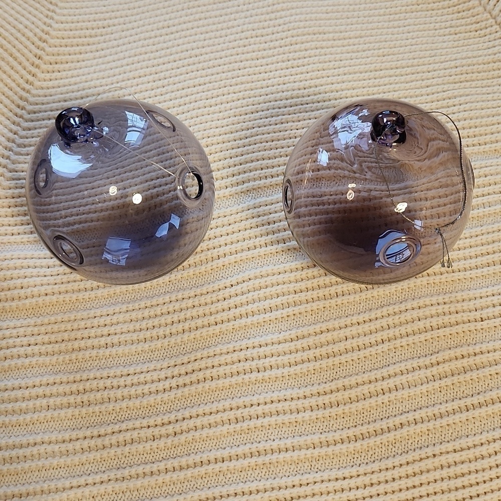 Pair of hand-made purple/pink glass Xmas ornaments with holes